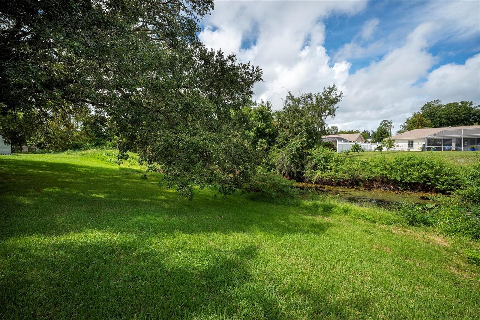 Back of property near canal's edge - 83 FARRAGUT DR, PALM COAST