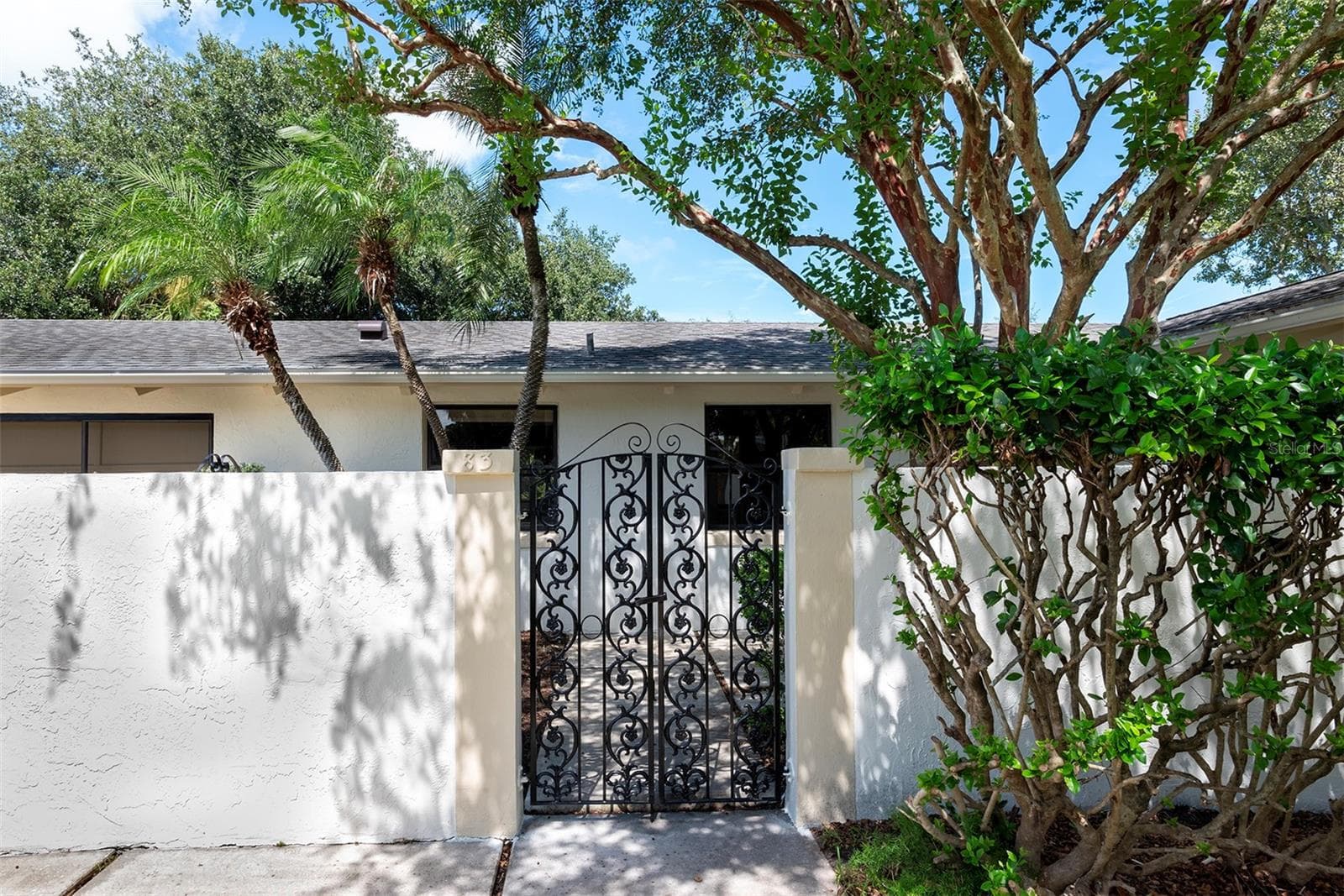 Gated small courtyard entry - 83 FARRAGUT DR, PALM COAST