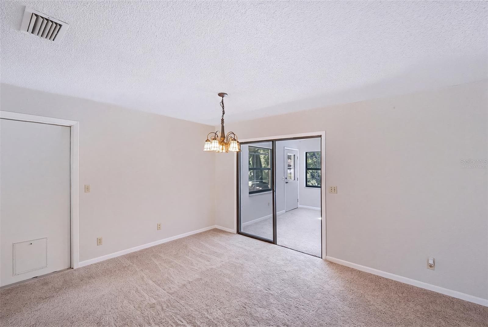 Virtually staged empty dinette adjacent to Florida room - 83 FARRAGUT DR, PALM COAST
