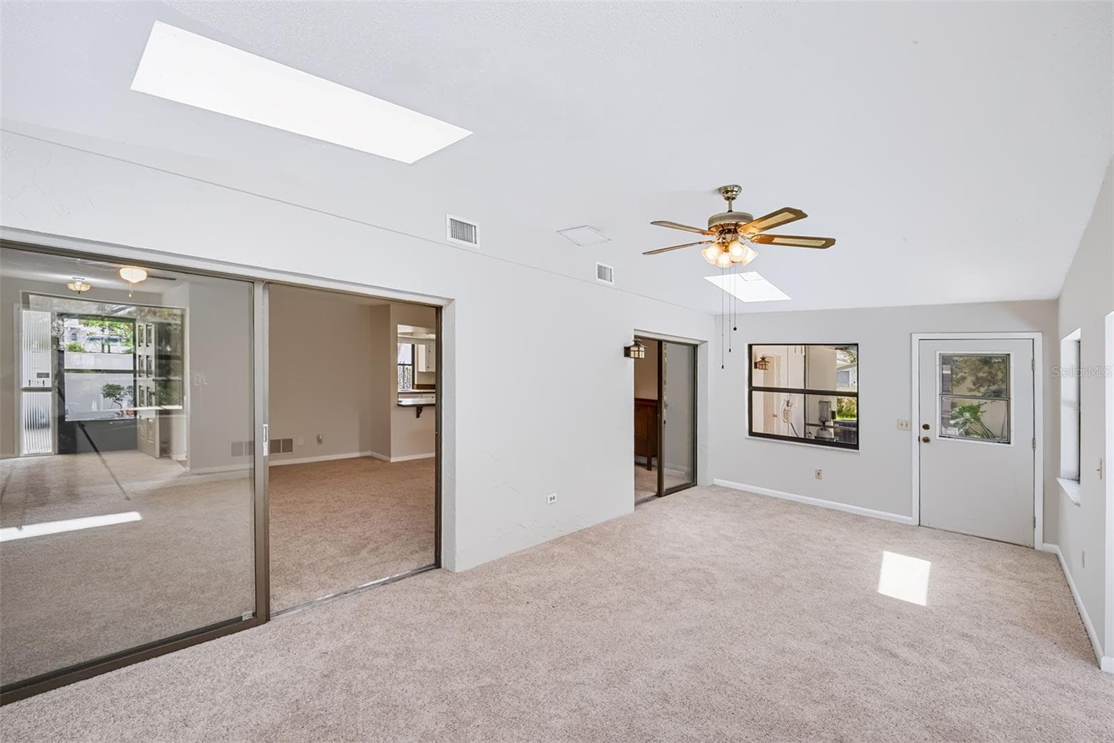 Another view from the Florida room toward the living room/dinette area - 83 FARRAGUT DR, PALM COAST