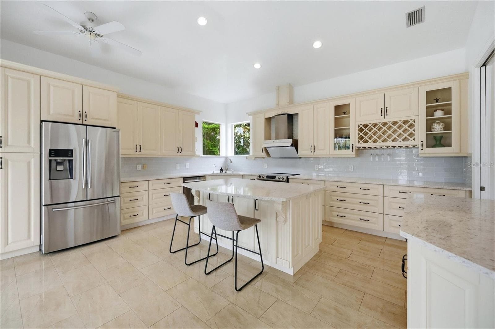 blonde wood cabinets, stainless steel appliances, stone counters, pantry cabinets, eat at island and work desk - 5458 46TH CT W, BRADENTON