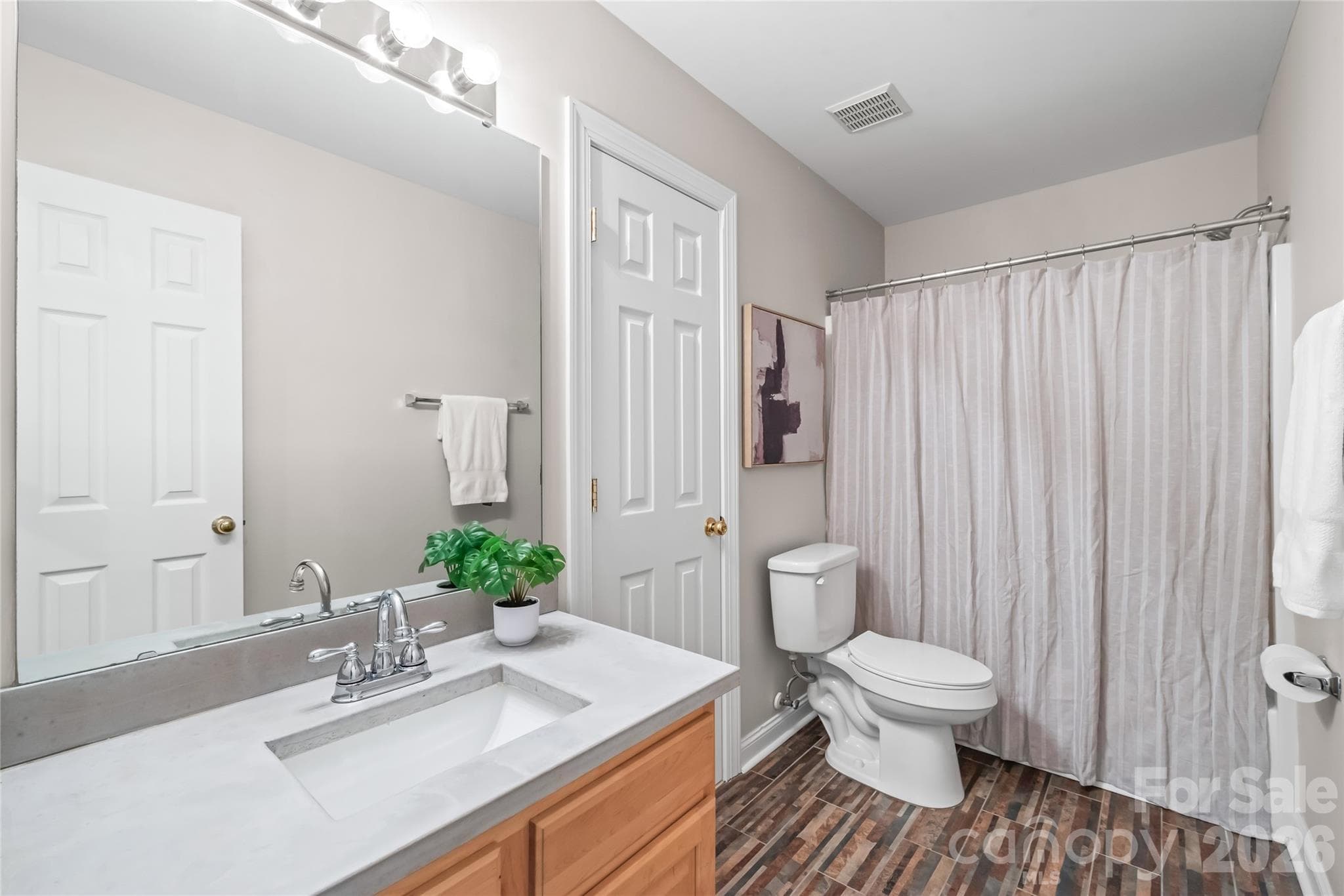 Full bath featuring updated countertops, a refreshed sink, and a classic tub/shower combo designed for simple, low-maintenance daily routines. Direct access to Bedroom 3. - 2008 Trace Creek Drive, Waxhaw