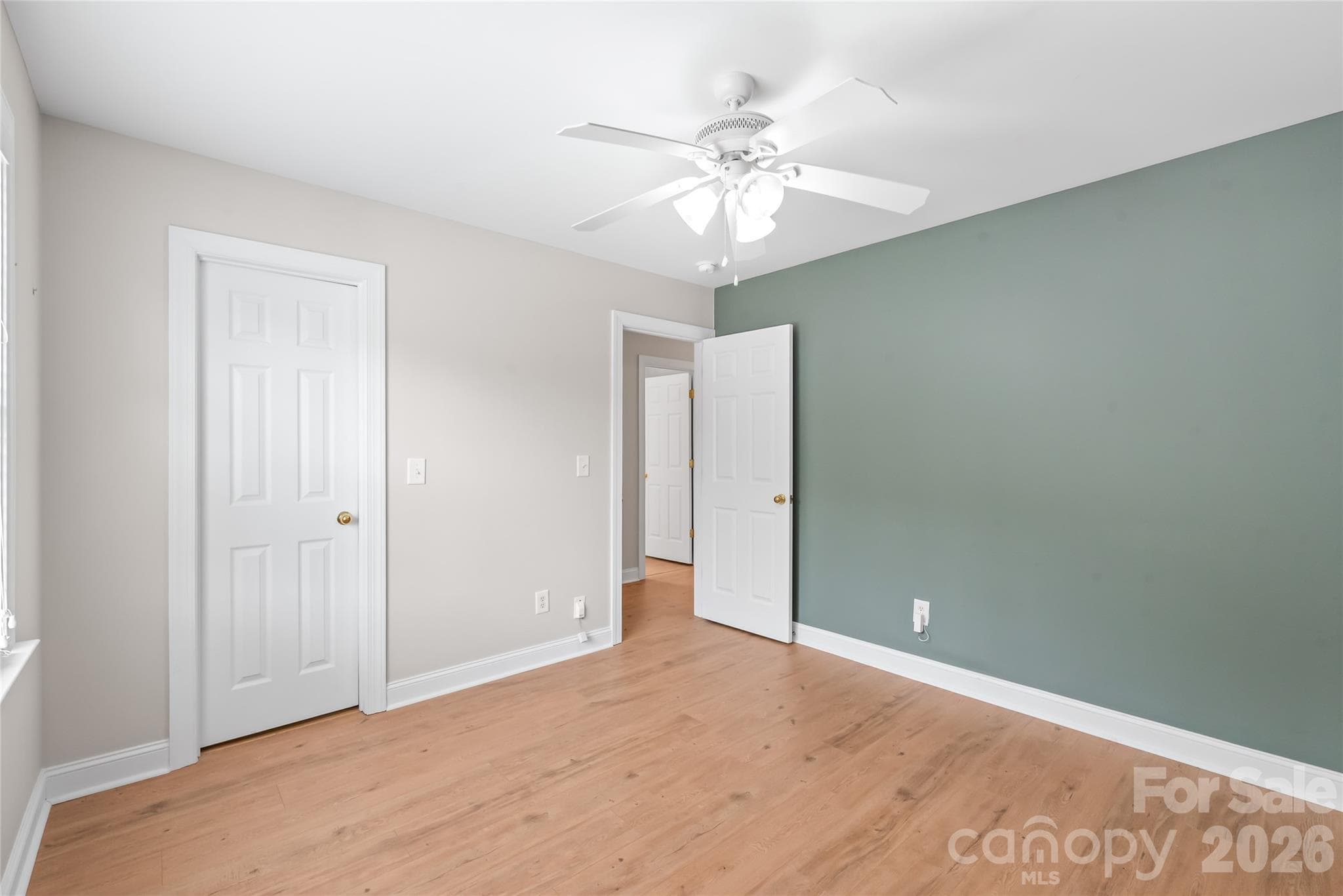 Bedroom 5 features low-maintenance LVP flooring. - 2008 Trace Creek Drive, Waxhaw
