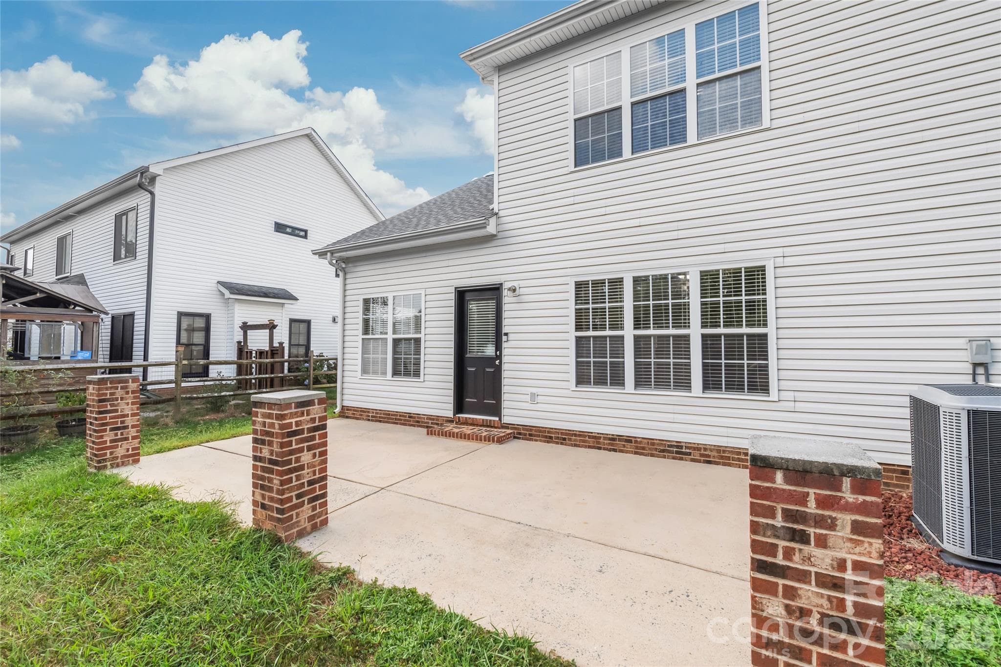 Built for low-maintenance outdoor living, the spacious concrete patio provides the perfect foundation for lounging, or hosting summer cookouts. - 2008 Trace Creek Drive, Waxhaw