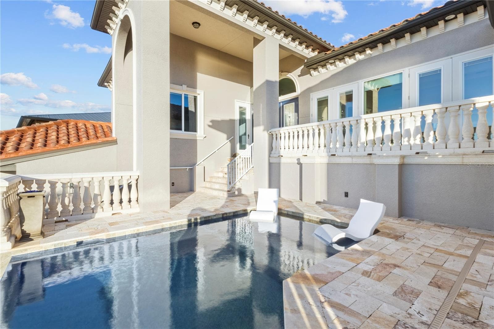 INFINITY EDGE POOL-Resort-Style Outdoor Living Along the Water - 107 SUNSET DR, NOKOMIS