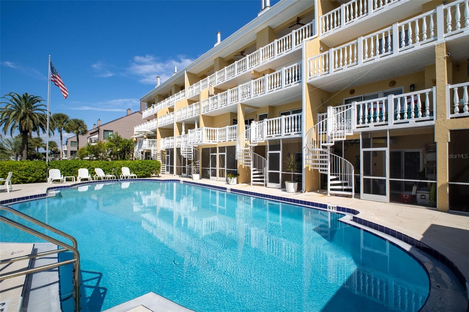 NOTE the circular staircases that runs from the unit balcony down to the pool area and private lounge area. - 544 PINELLAS BAYWAY S #F8, TIERRA VERDE