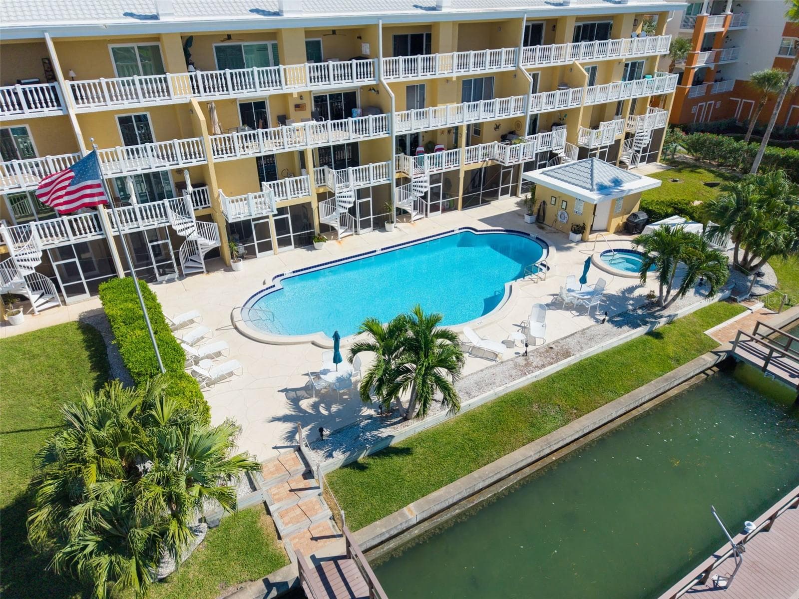 Aerial View NOTE the circular staircases that run from the unit to pool level & lounge area - 544 PINELLAS BAYWAY S #F8, TIERRA VERDE