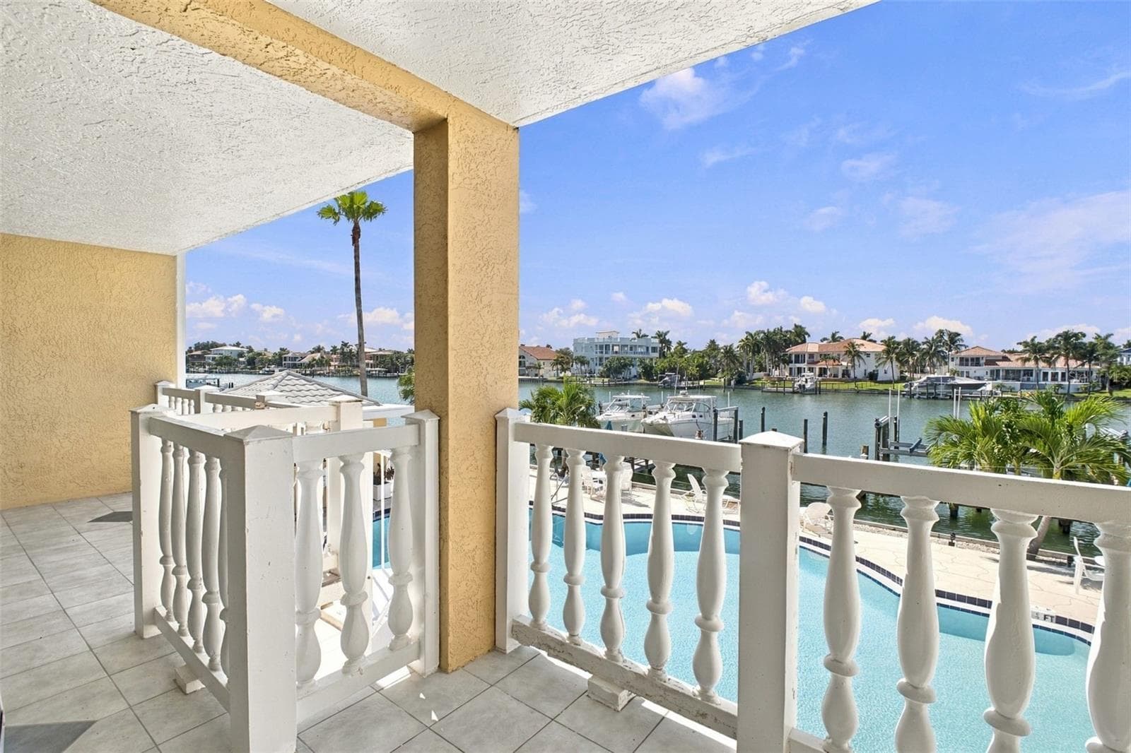 NOTE the circular staircases that runs from the unit balcony down to the pool area and private lounge area. - 544 PINELLAS BAYWAY S #F8, TIERRA VERDE