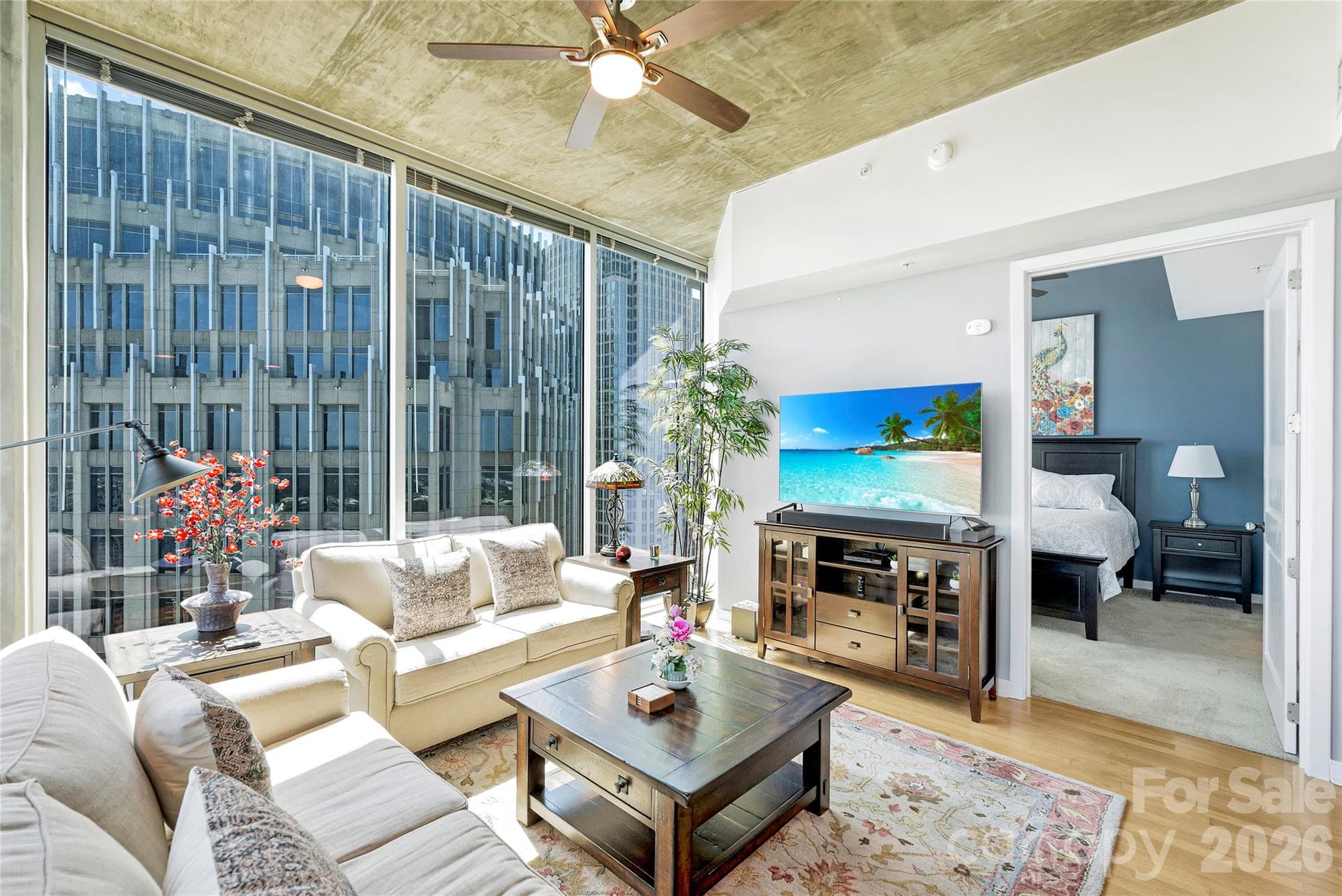 Light-filled living room surrounded by floor-to-ceiling windows - 210 N Church Street, Charlotte
