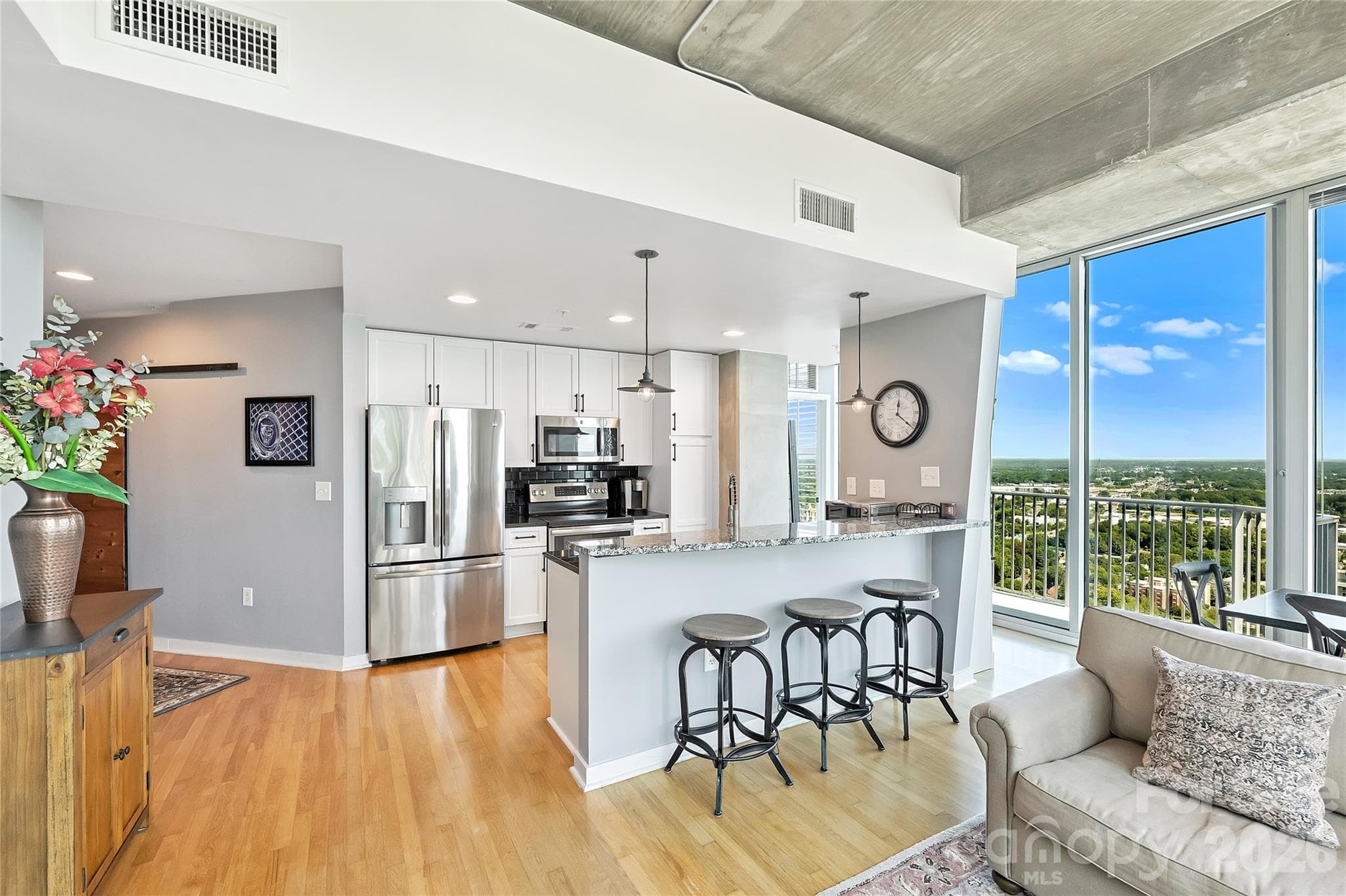Updated kitchen opens directly to the living space and views - 210 N Church Street, Charlotte