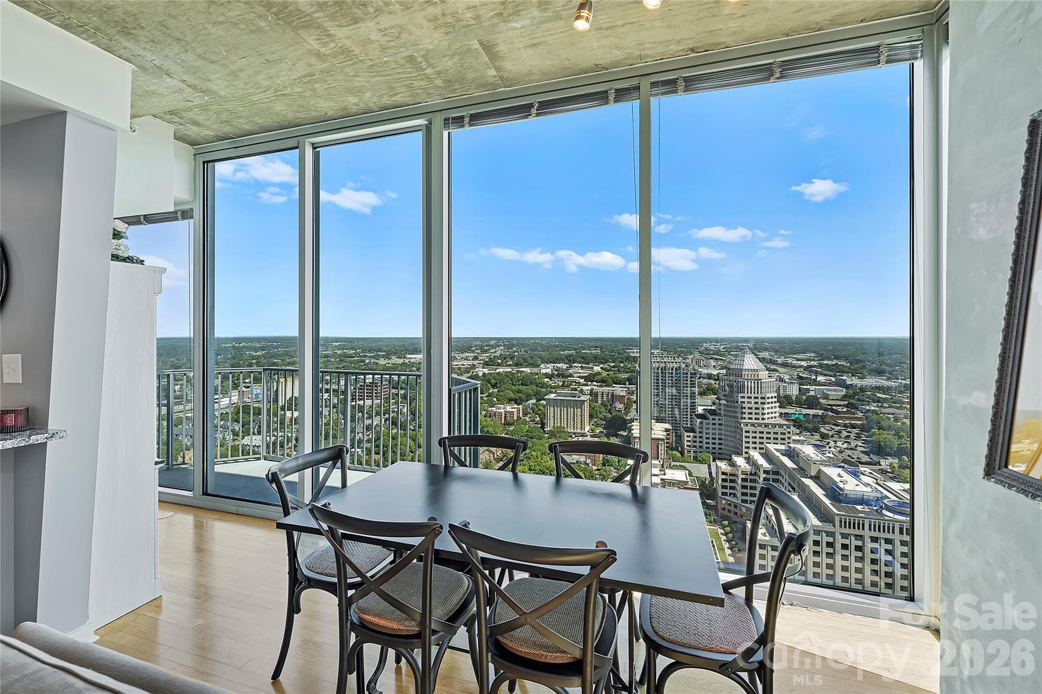 Dining area framed by incredible high-floor views - 210 N Church Street, Charlotte