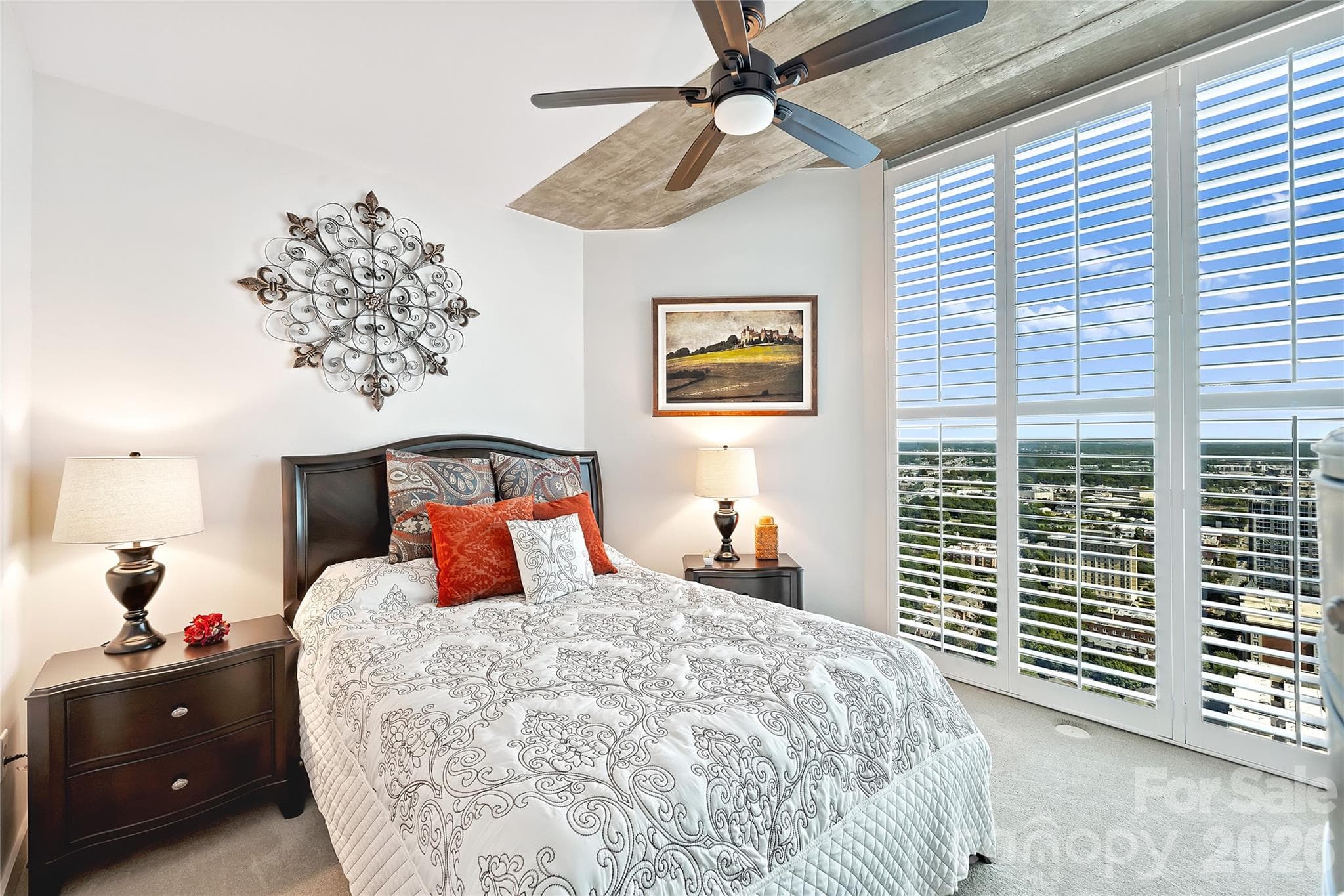 Second bedroom with high-floor views and plantation shutters - 210 N Church Street, Charlotte