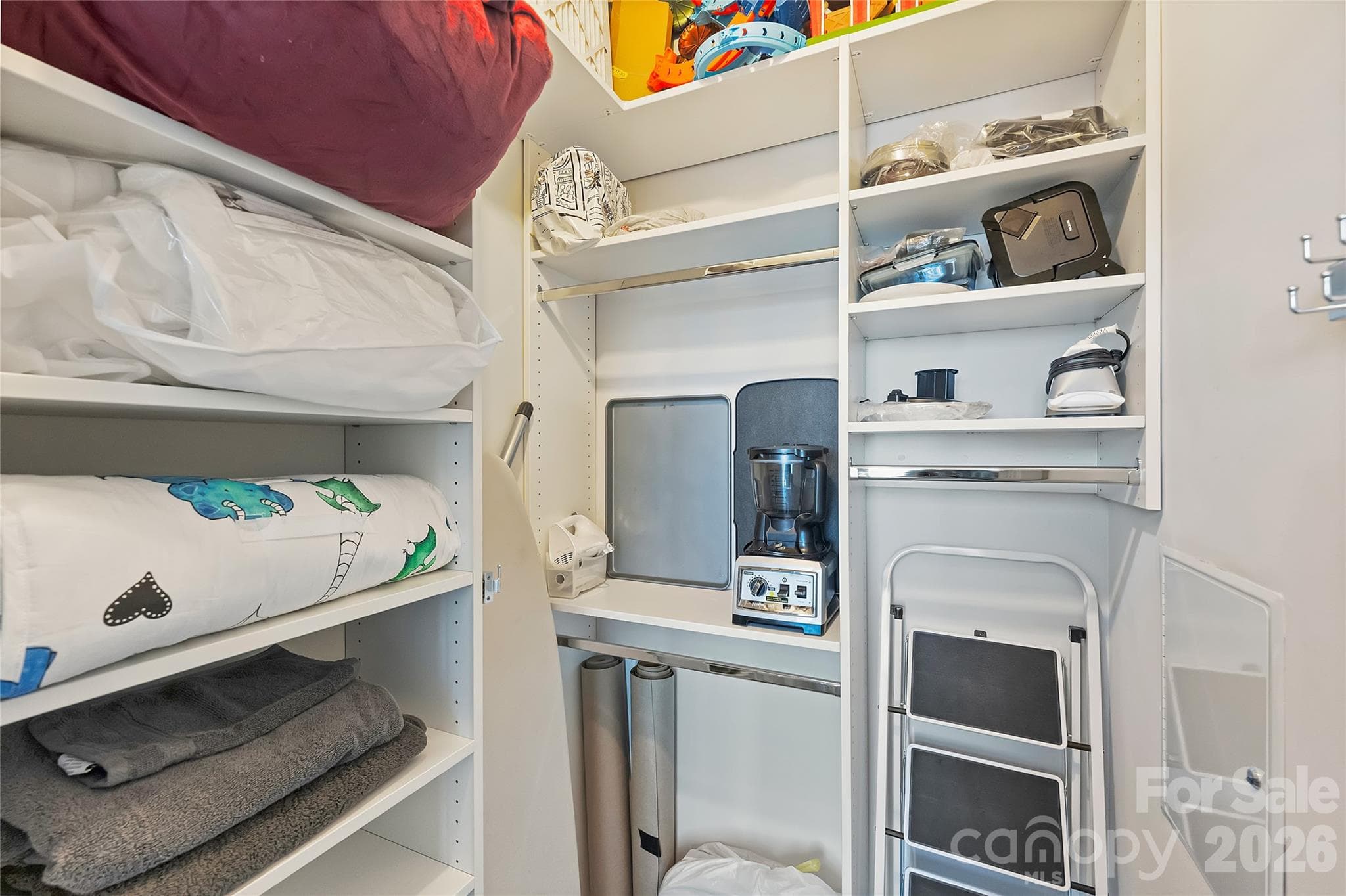 Custom closet system maximizes second-bedroom storage - 210 N Church Street, Charlotte