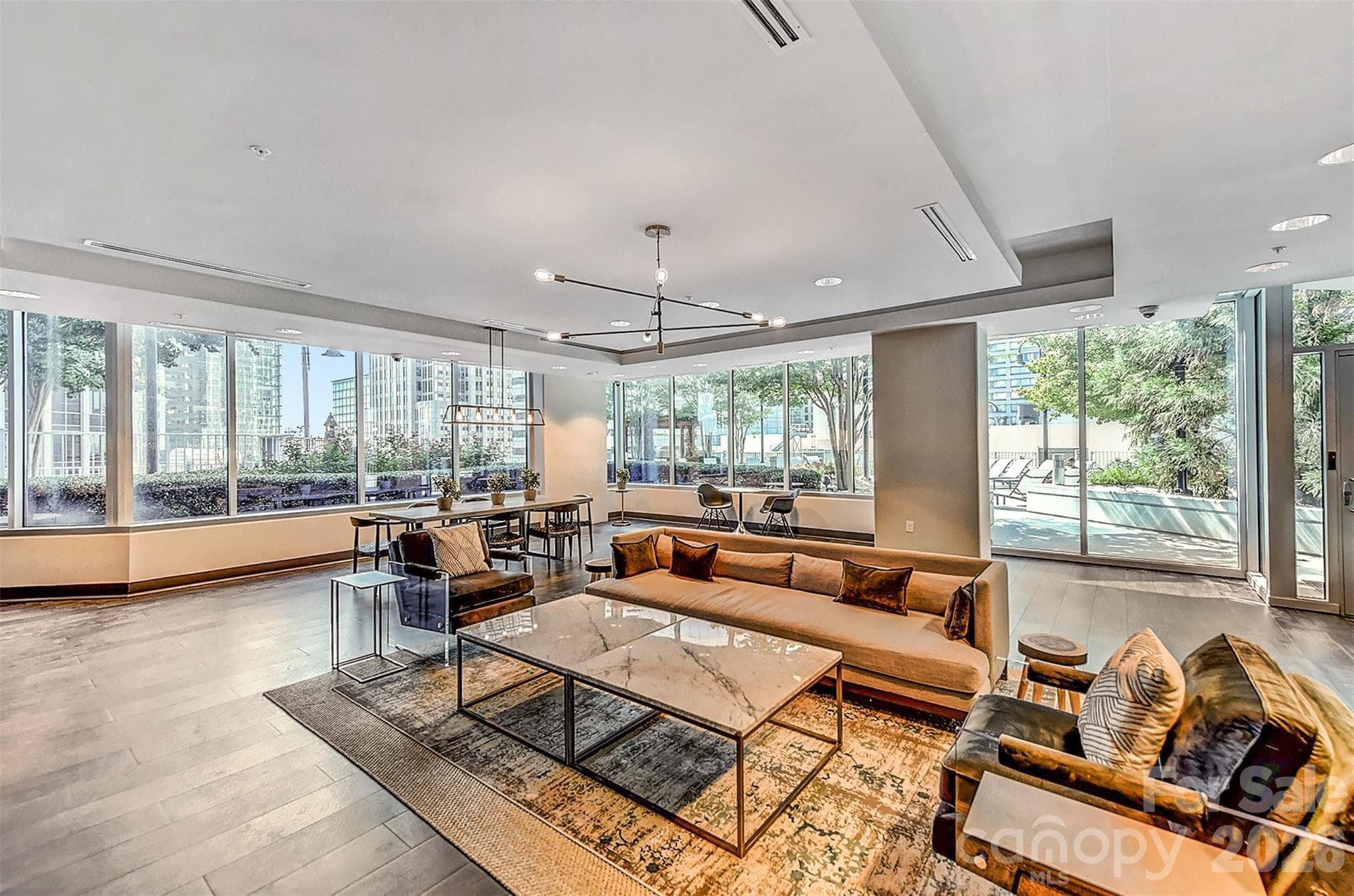 Resident lounge with walls of glass and city views - 210 N Church Street, Charlotte