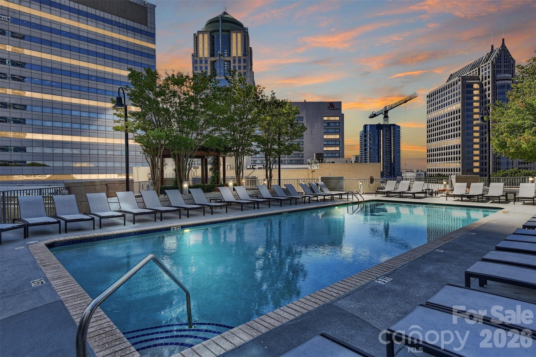 Avenue's pool surrounded by the Uptown skyline - 210 N Church Street, Charlotte