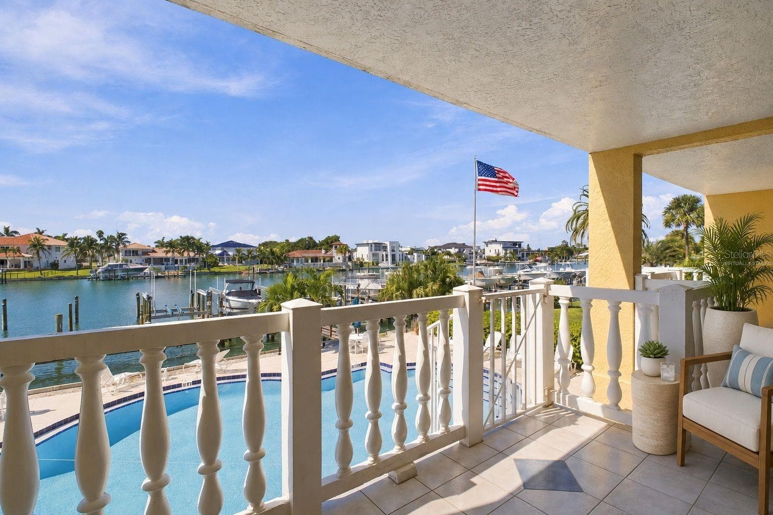 Virtually staged Balcony view from living room - 544 PINELLAS BAYWAY S #F8, TIERRA VERDE