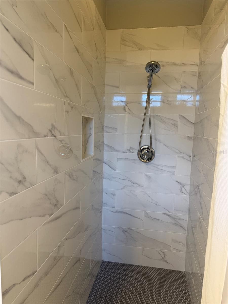 Newly renovated and never used Primary shower with shampoo niche. - 3308 60TH AVE W, BRADENTON