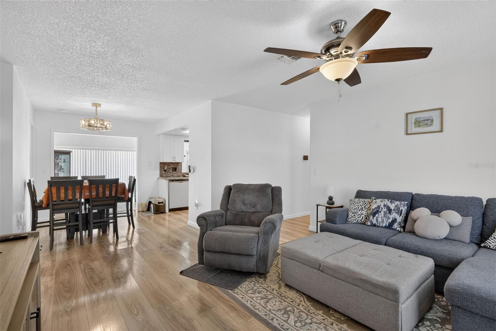 Living room as you walk in the front door with dining in the far left - 82 CIRCLEWOOD DR #A3-4, VENICE