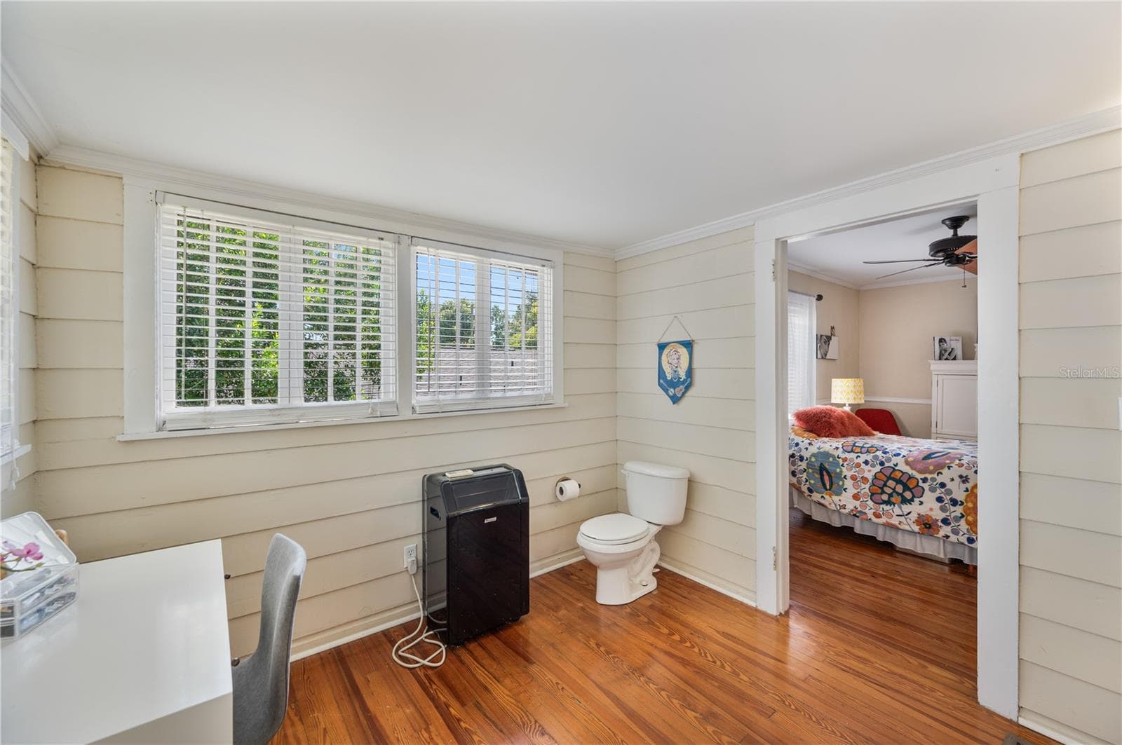 Large extra room off the primary bedroom being used as a half bath. Large extra room off the primary bedroom being used as a half bath. Large walk-in closet is off this room from closet doors - 412 E PALM DR, LAKELAND