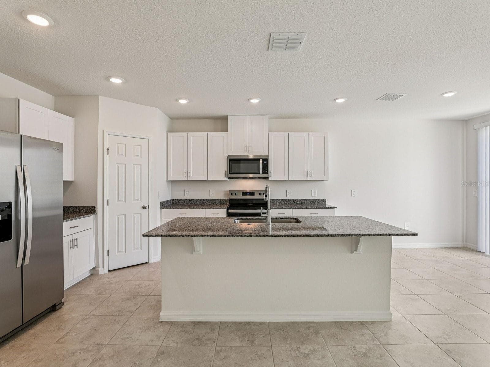 Photo is not of the actual home, but is an inspirational photo of builder’s model home and may depict options, furnishings, and/or decorator features that are not included - 1380 OAK VALLEY DR, AUBURNDALE