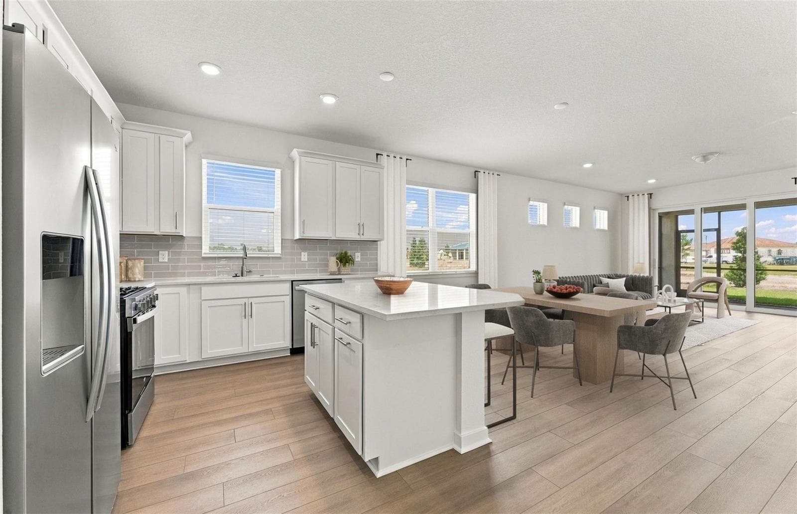 Virtually Staged - Open Kitchen to Cafe to Gathering Room - 12506 ADOBE ST, PARRISH