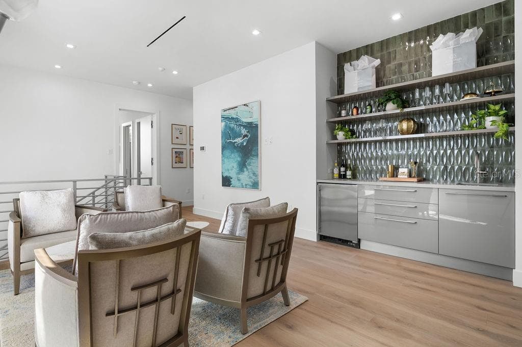 Second floor hosts a morning/evening bar and seating for a cozy conversation - 6489 GULFSIDE RD, LONGBOAT KEY