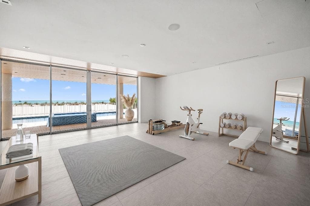 Virtually staged flex space on first floor is under air and overlooks the pool, spa and private beach - 6489 GULFSIDE RD, LONGBOAT KEY