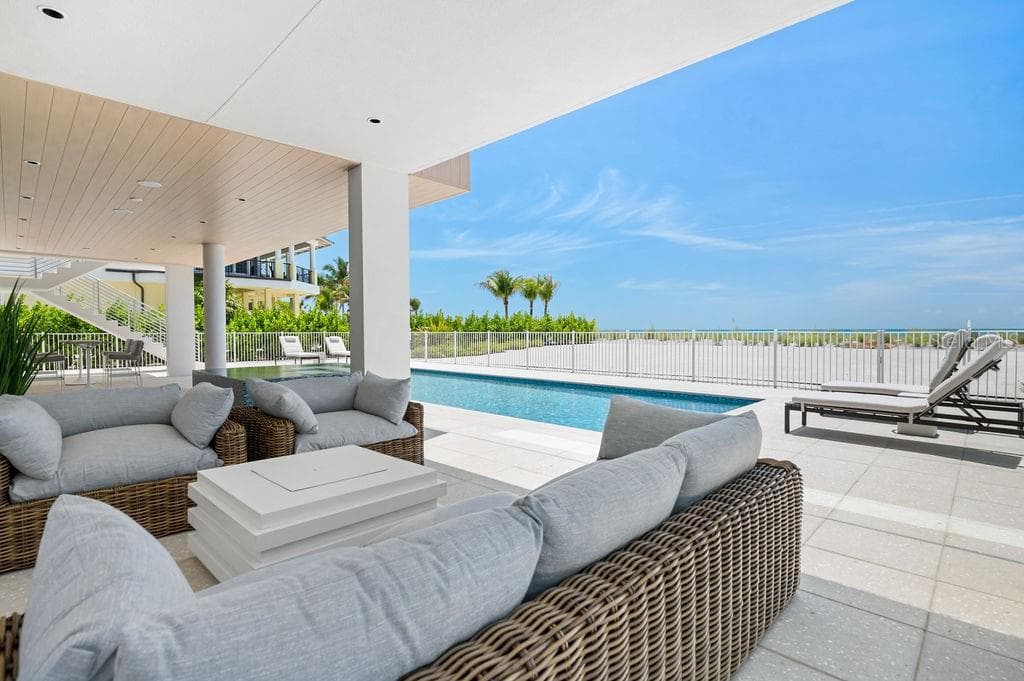 Covered seating area near the Spa and Pool provides shade and sweeping Gulf views - 6489 GULFSIDE RD, LONGBOAT KEY