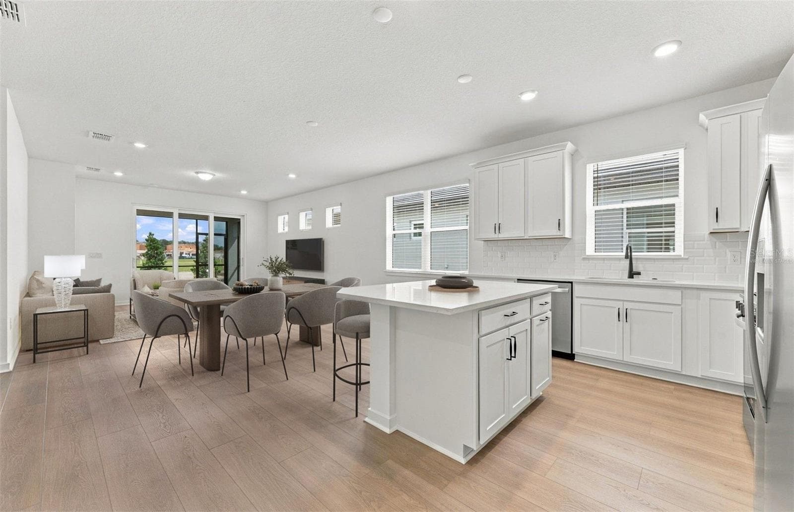 Virtually Staged - Open Kitchen to Cafe to Gathering Room - 12510 ADOBE ST, PARRISH
