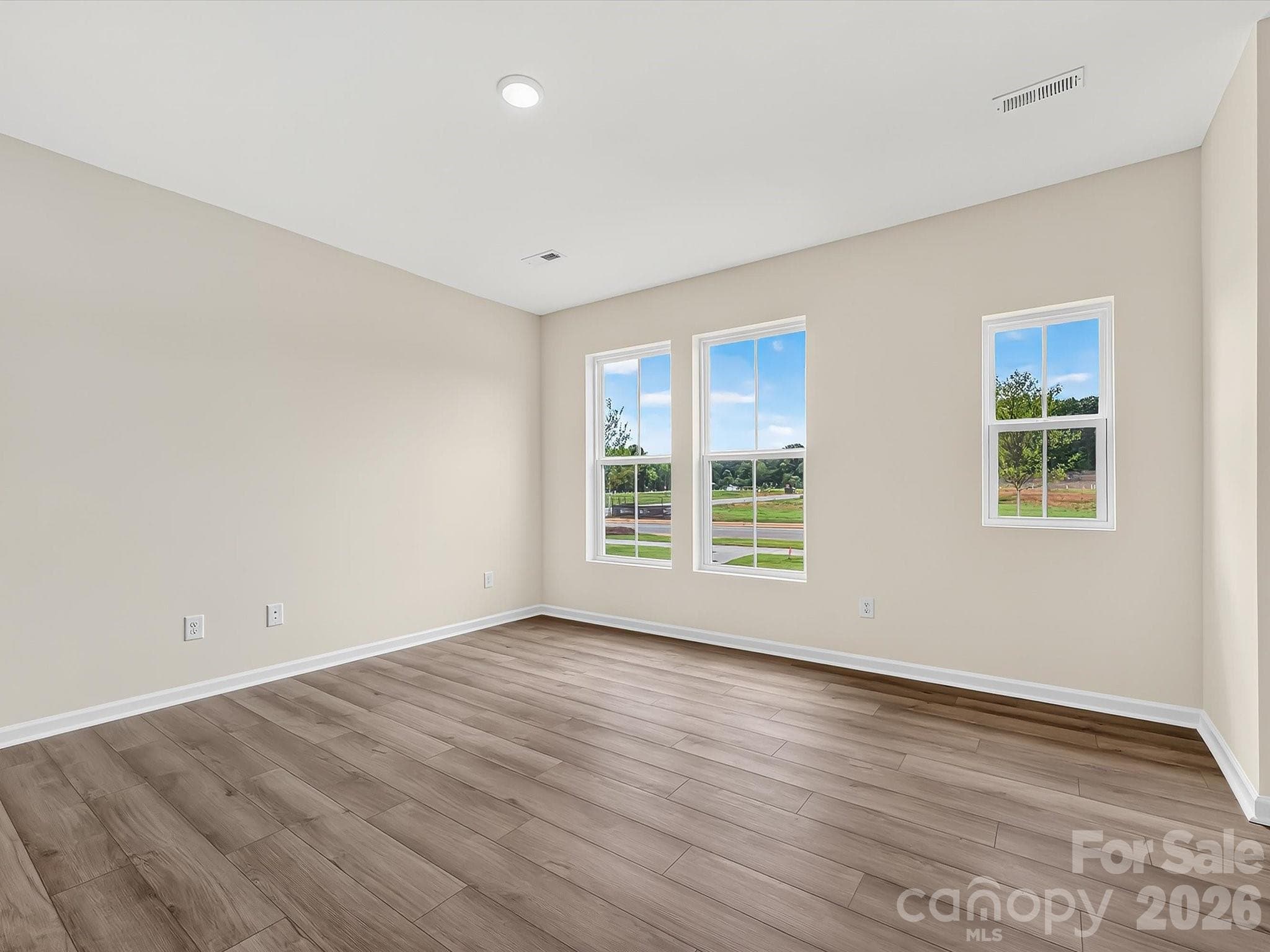 Family Room Offering an Abundance of Light - 6565 Fire Lily Lane, Charlotte