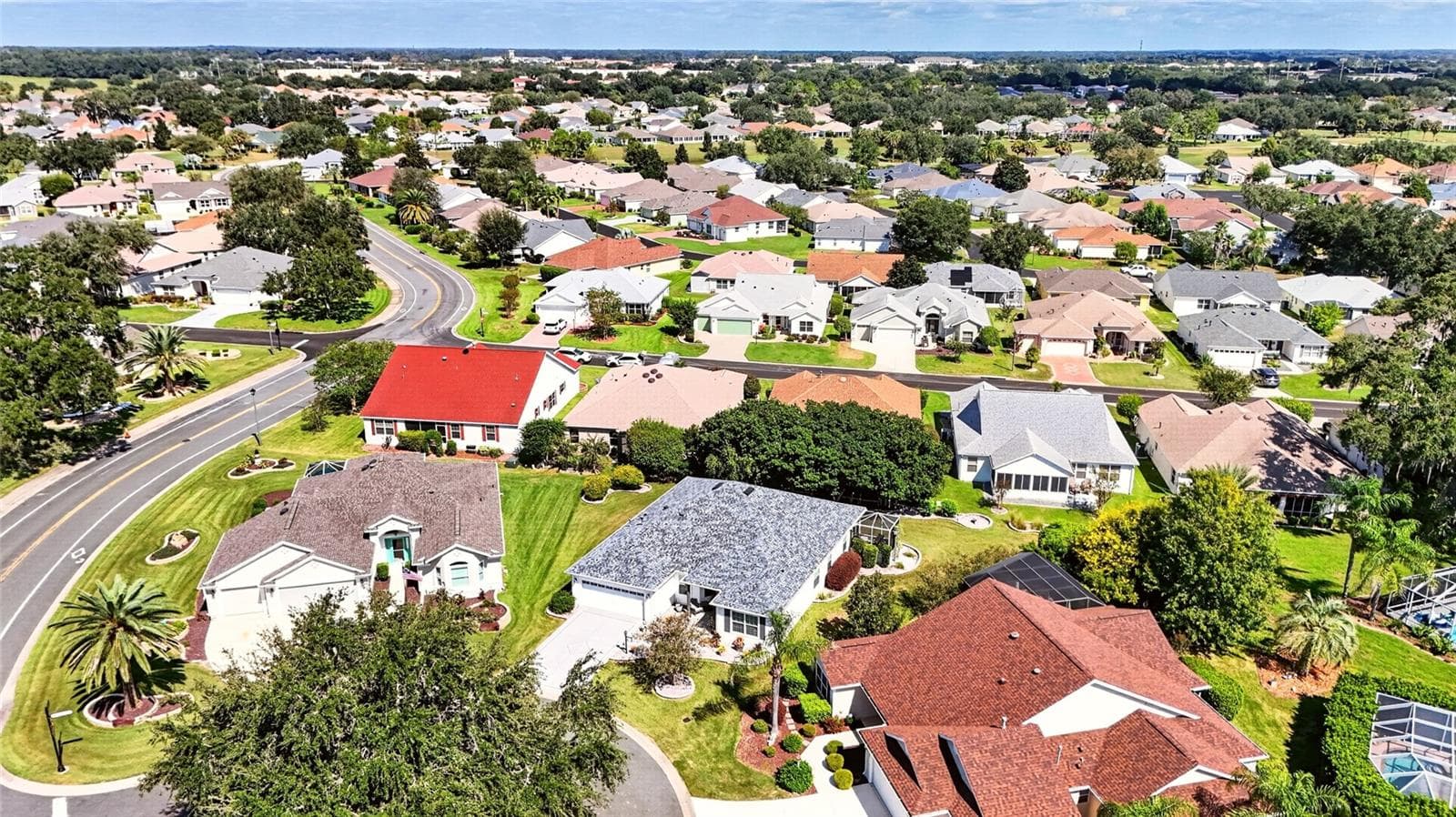 Neighborhood Aerial: Wide aerial view provides additional perspective of the home and the surrounding residential streets and properties. - 2749 BANYAN PL, THE VILLAGES