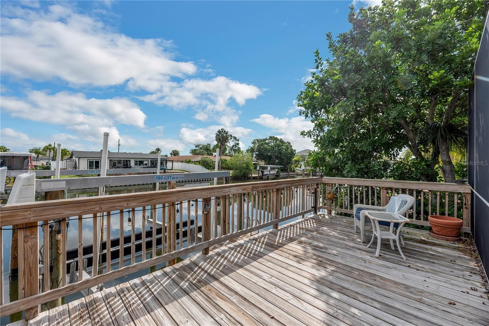 Boating enthusiasts will appreciate two private docks with boat lifts and a wood deck overlooking the canal. - 743 KINGSTON CT, APOLLO BEACH