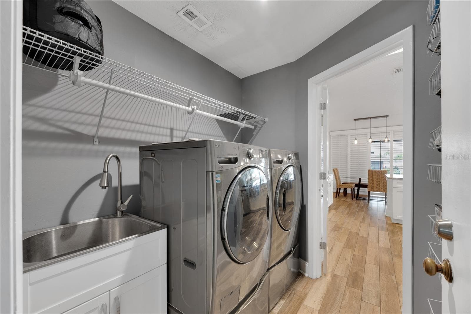There is a convenient utility sink inside the laundry room. - 743 KINGSTON CT, APOLLO BEACH