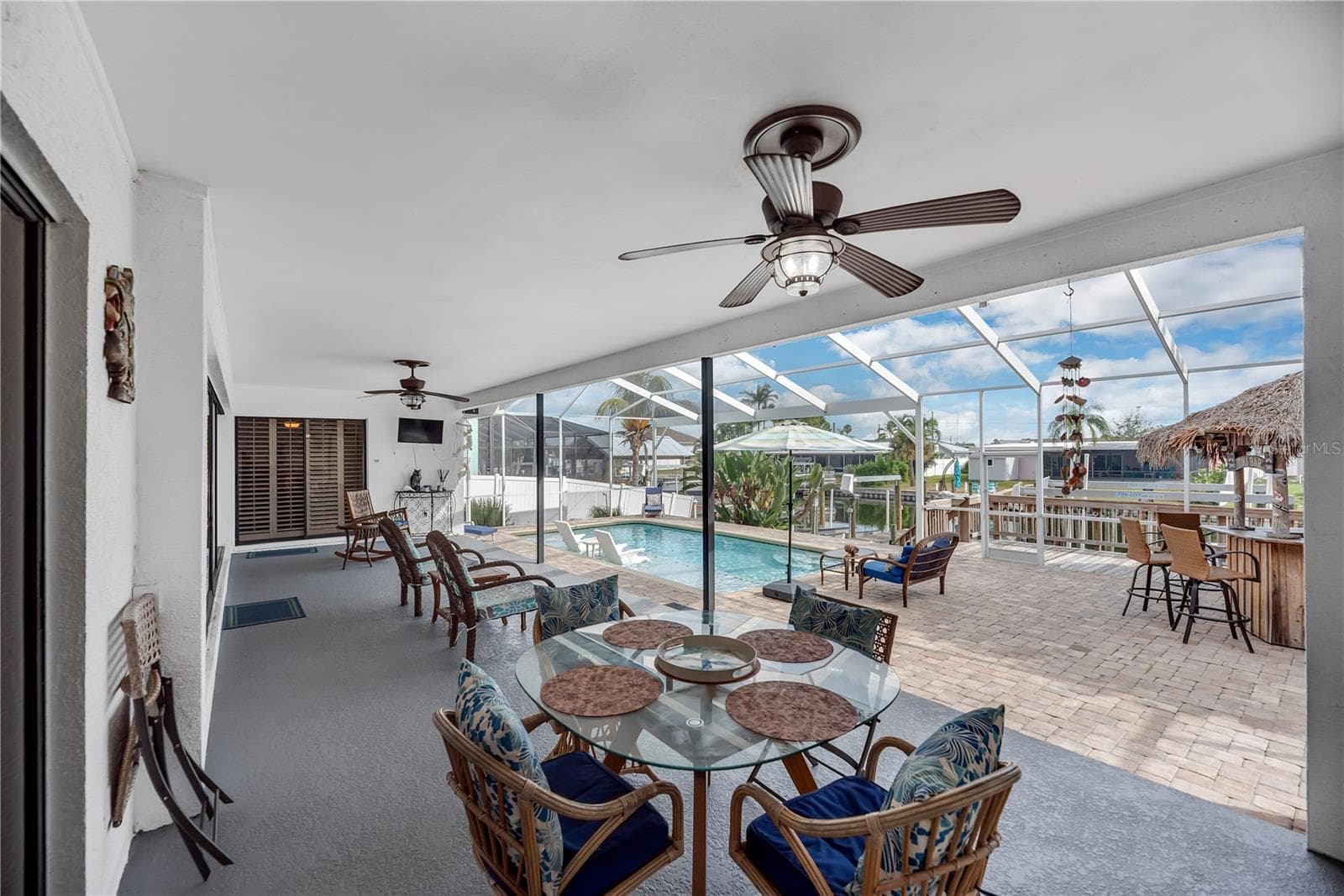 The spacious covered area provides plenty of shade and protection from Florida’s sun and passing showers, making outdoor enjoyment comfortable year-round. - 743 KINGSTON CT, APOLLO BEACH