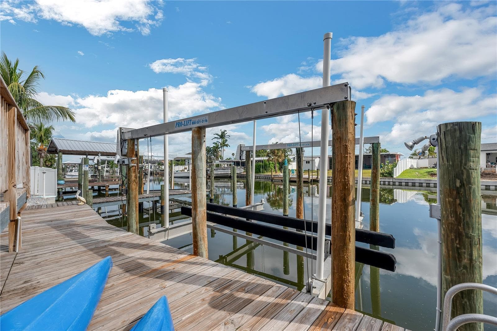 The lower deck provides convenient access to both boat lifts and has electric, water, lighting and a ladder for swimming. - 743 KINGSTON CT, APOLLO BEACH