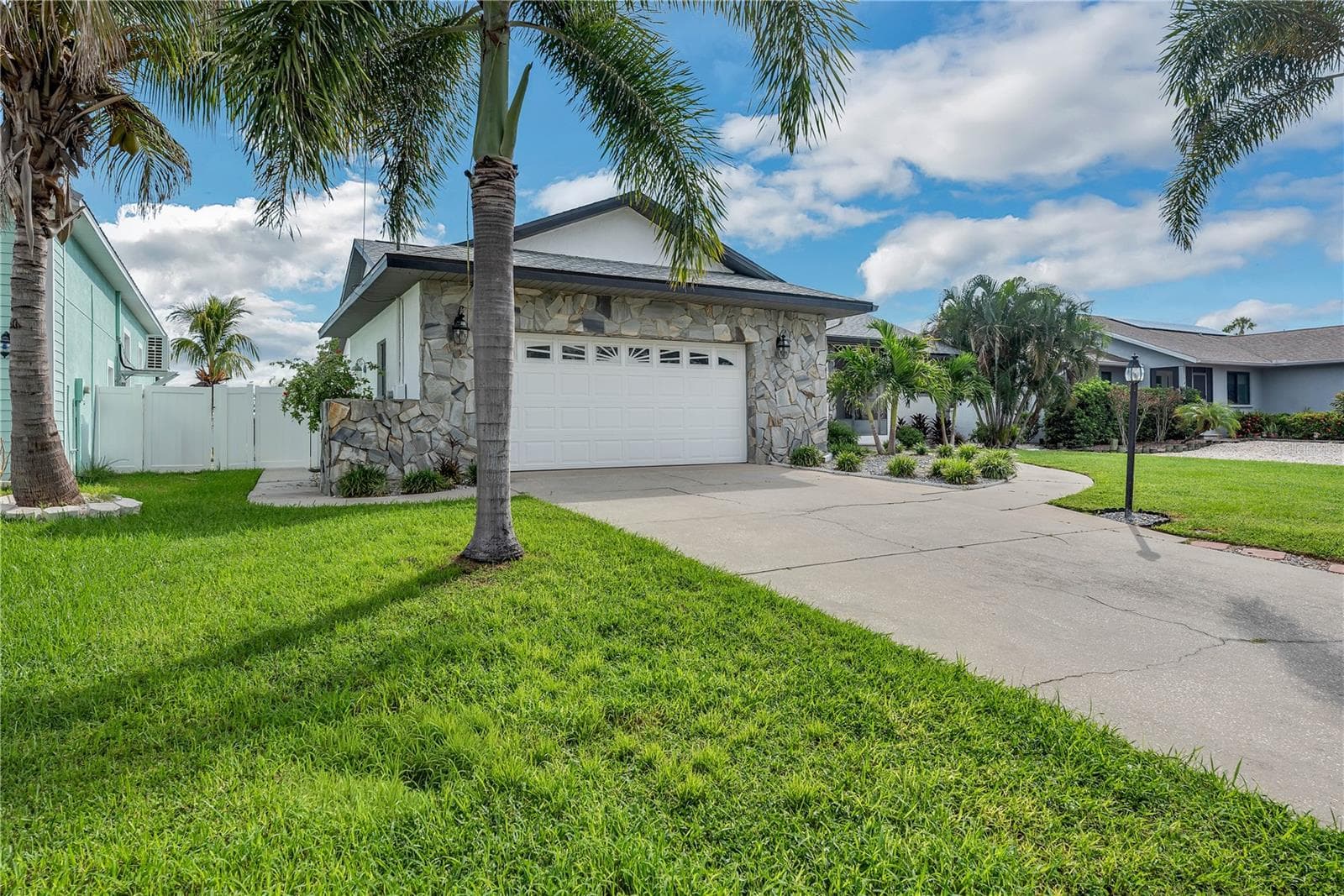 The A/C system is approximately 7 years old. Additional conveniences include a central vacuum system, water softener, and washer/dryer hookups in both the garage and indoor laundry room. - 743 KINGSTON CT, APOLLO BEACH