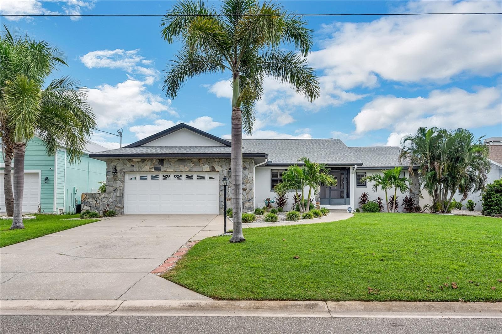The home experienced no water damage during the past hurricane seasons and sits at a higher elevation than the adjacent canal. - 743 KINGSTON CT, APOLLO BEACH