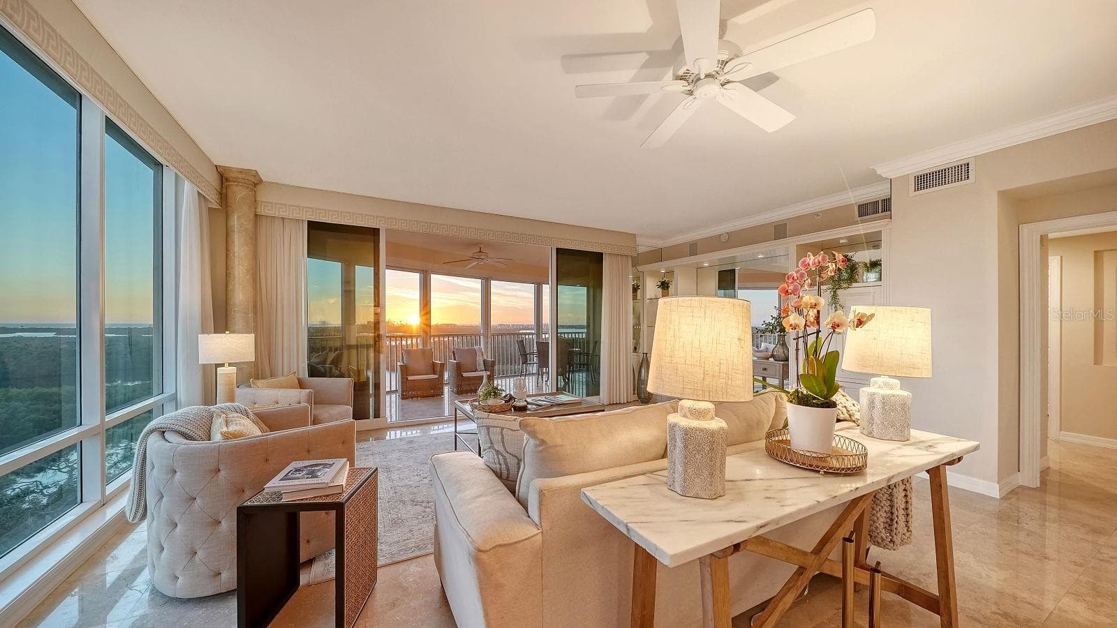 Living area and lanai with sweeping waterfront & sunset views - 385 NORTH POINT RD #701, OSPREY