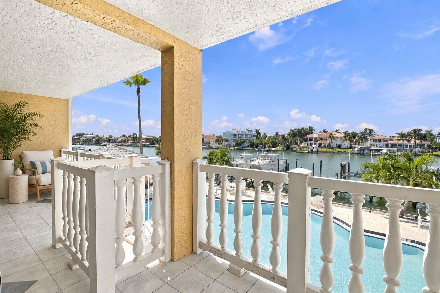 Virtually staged Balcony view from Primary bedroom - 544 PINELLAS BAYWAY S #F8, TIERRA VERDE