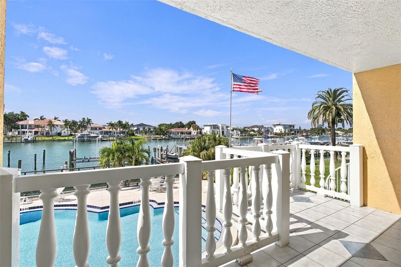 Virtually staged Balcony view from living room - 544 PINELLAS BAYWAY S #F8, TIERRA VERDE