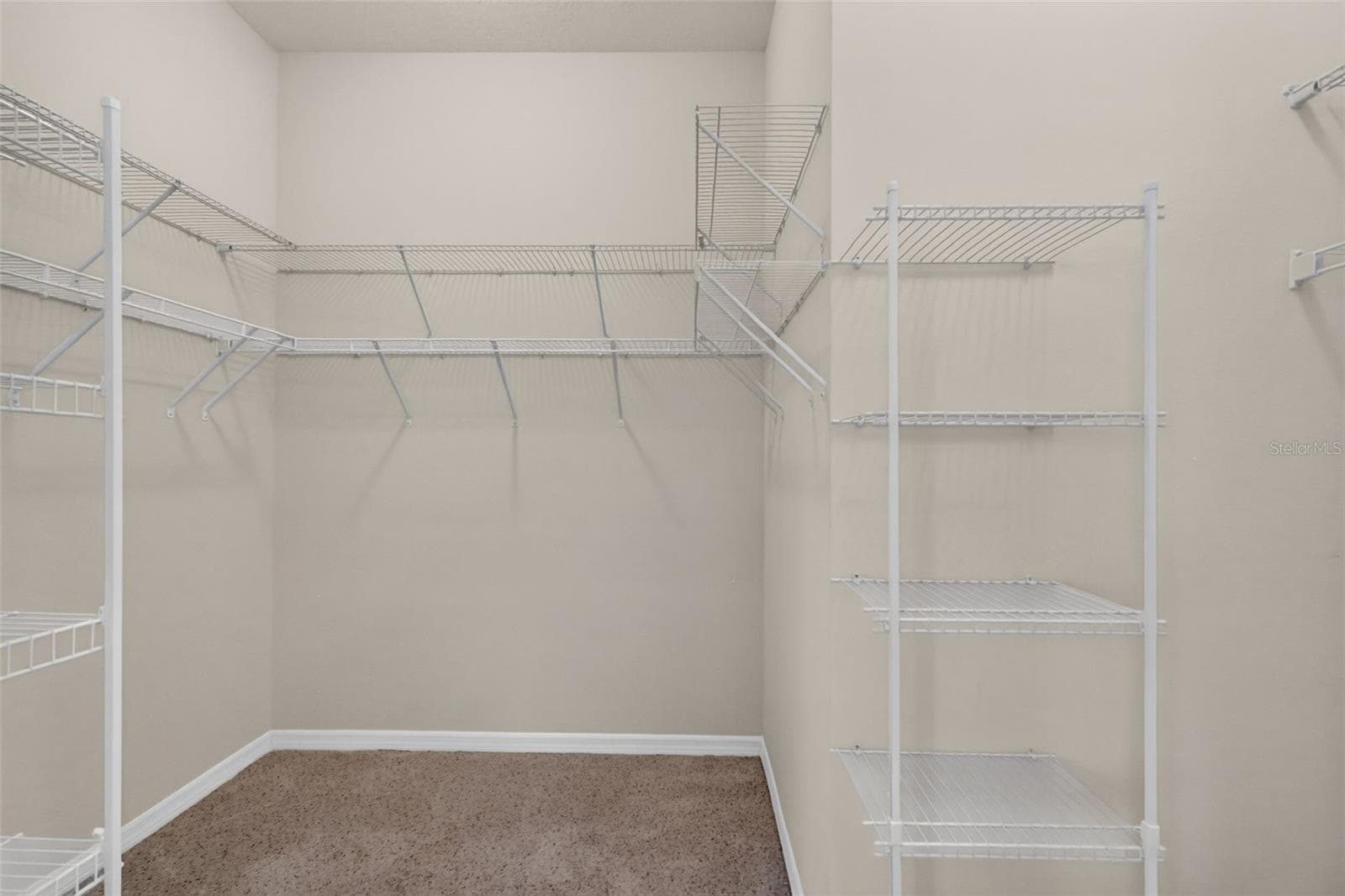 Primary Bedroom Walk-In Closet - 3376 MAYFLOWER LOOP, THE VILLAGES