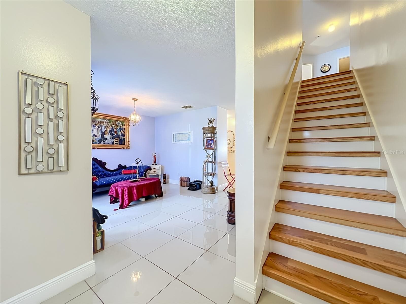 First floor is all ceramic tile, and wood leads to upstairs where all floors are wood laminate - 12900 LOS ALAMITOS CT, ORLANDO