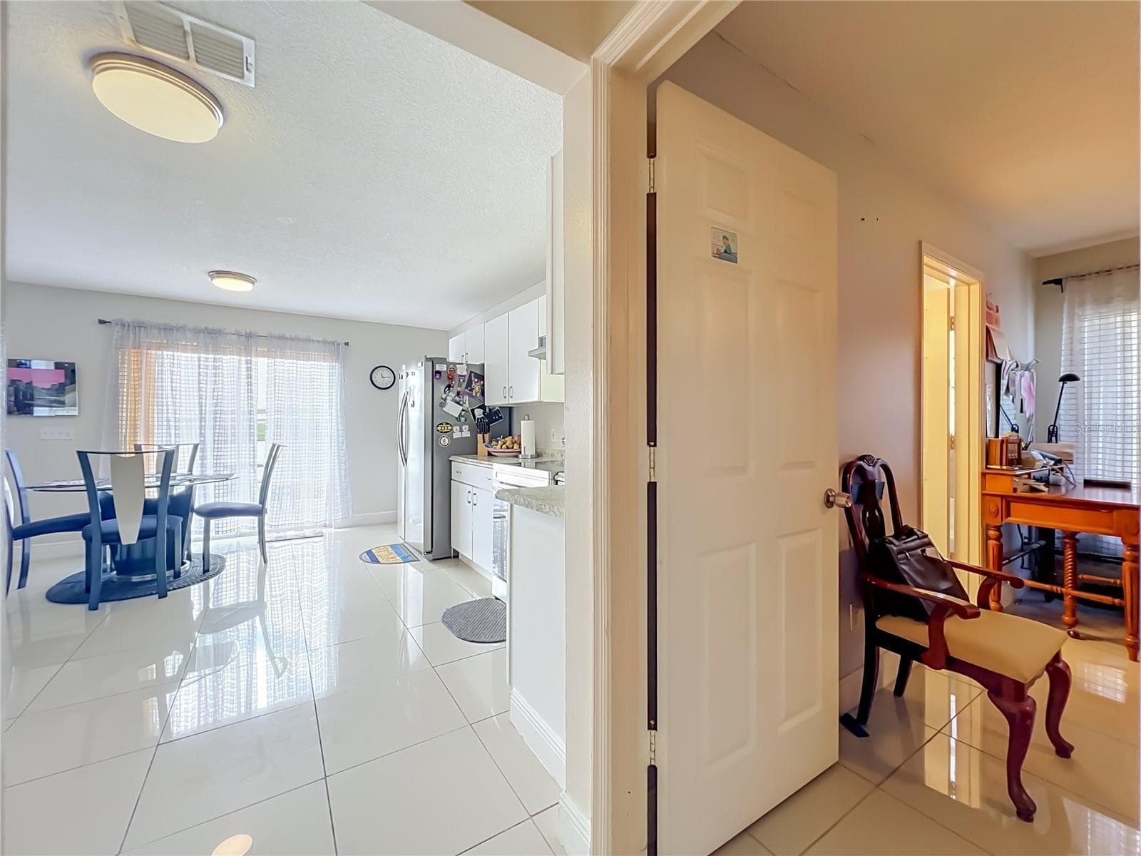 Dinette off kitchen is next to Primary bedroom on 1st floor - 12900 LOS ALAMITOS CT, ORLANDO