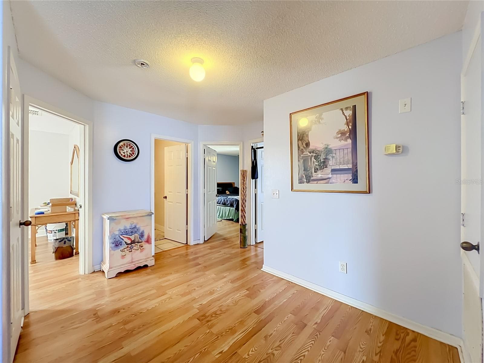 Beautiful wood laminate floors lead to 3 bedrooms on 2nd floor - 12900 LOS ALAMITOS CT, ORLANDO