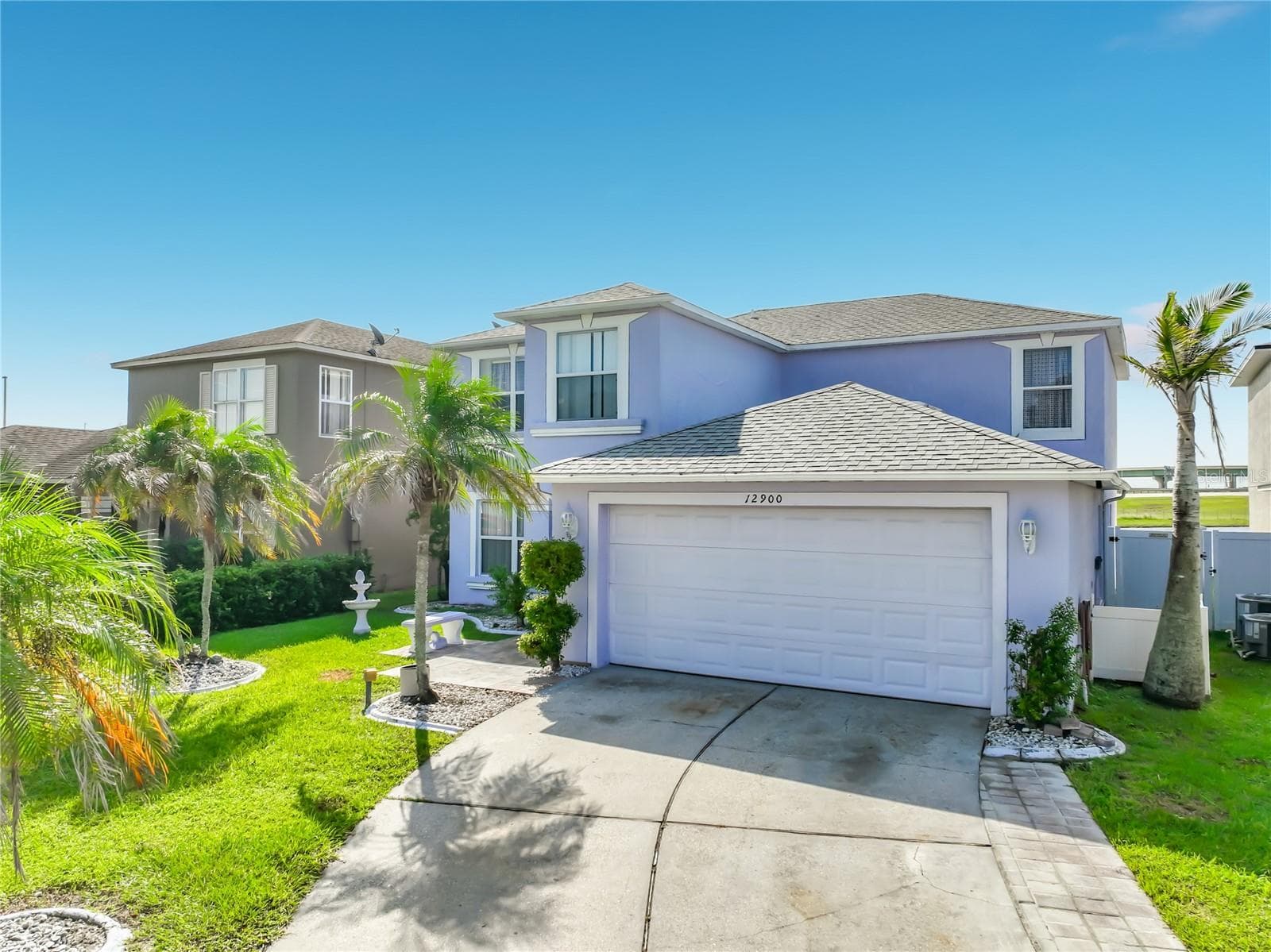 Front of the home. Attached 2 car garage. - 12900 LOS ALAMITOS CT, ORLANDO
