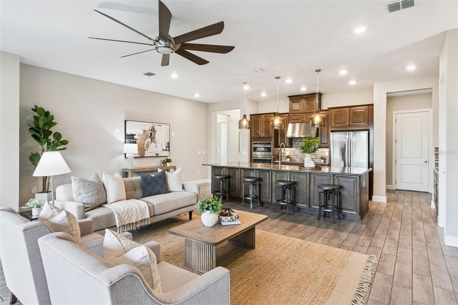 Bright living room open to the kitchen, ideal for everyday living and effortless entertaining. - 4108 VIA TOLEDO CT, POINCIANA