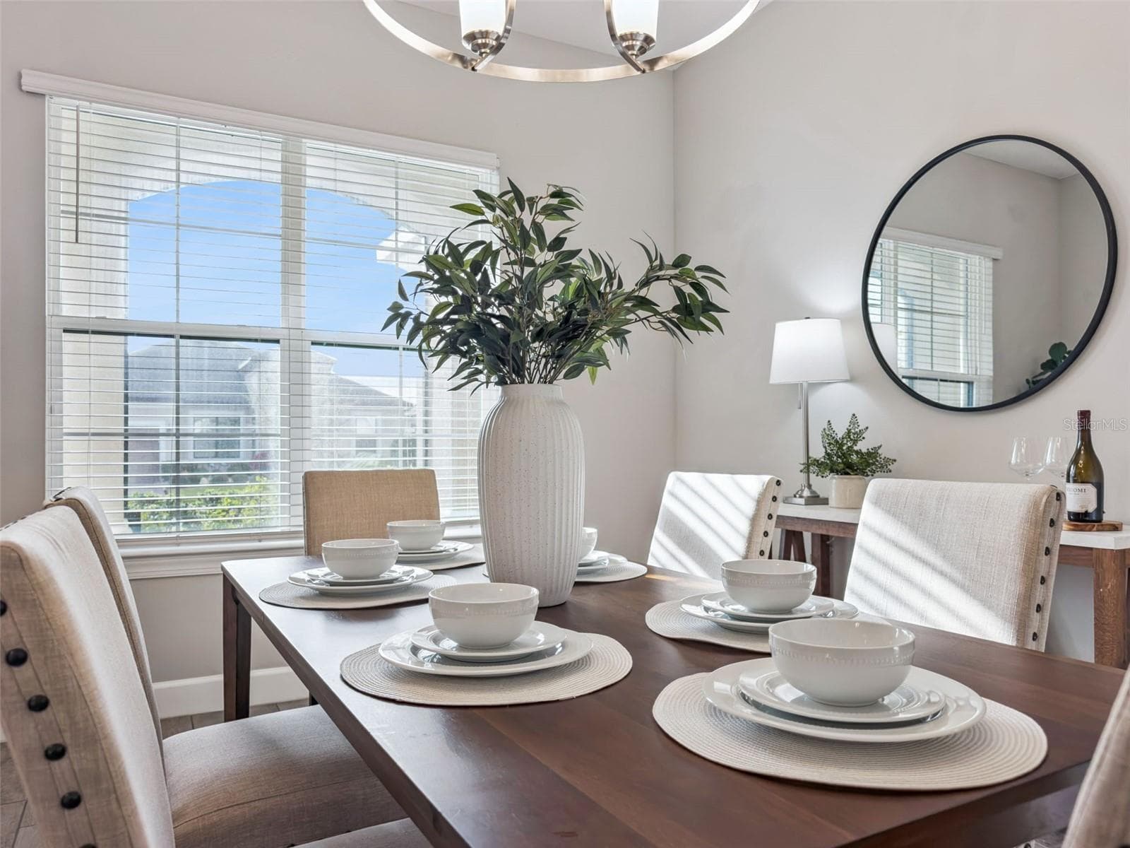 Dining room detail with sunny windows and room for family and friends. - 4108 VIA TOLEDO CT, POINCIANA