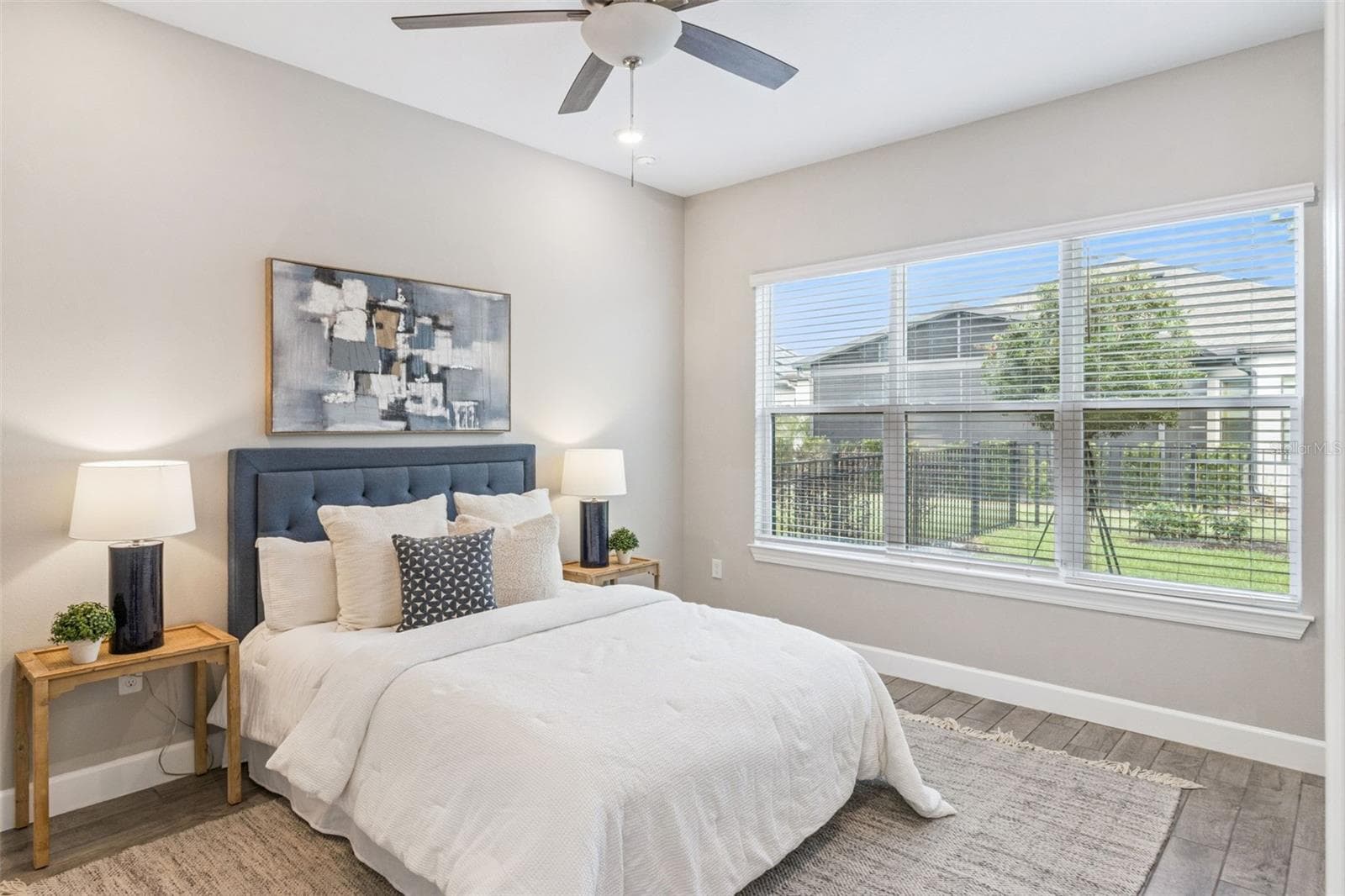 Second primary bedroom, offering privacy and flexibility for multigenerational living or visiting family. - 4108 VIA TOLEDO CT, POINCIANA