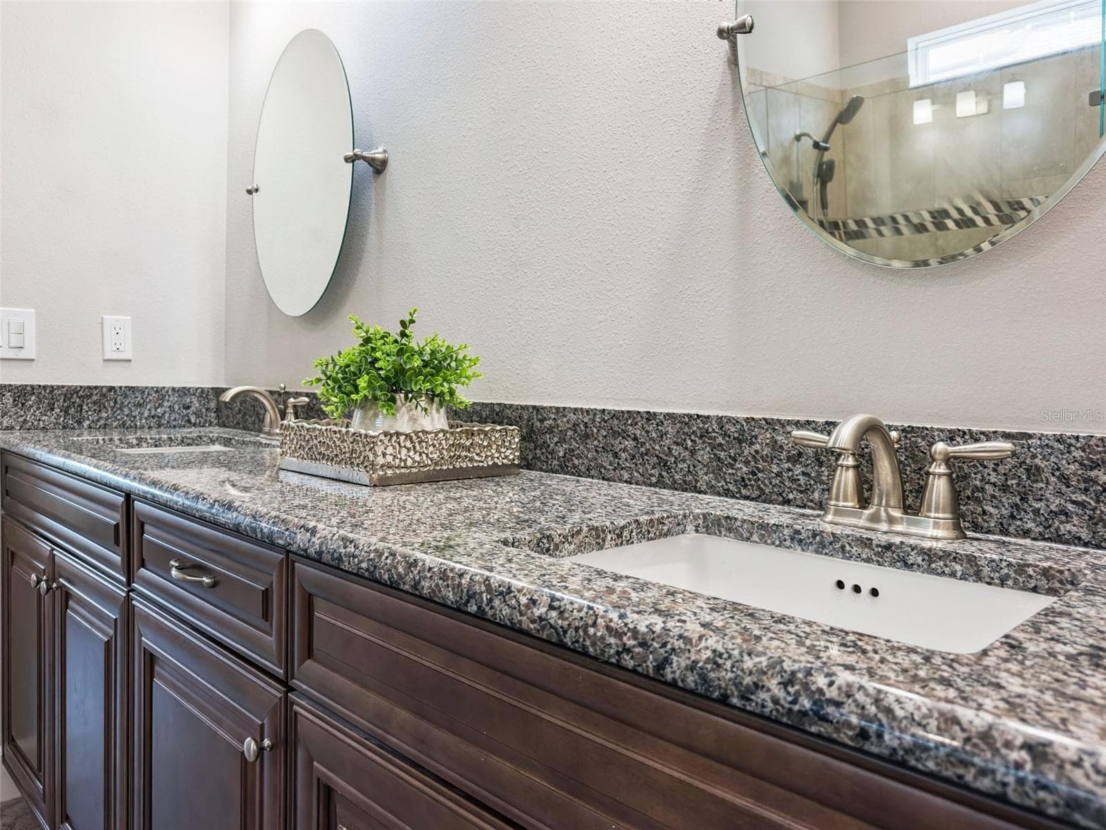 Bathroom vanity with granite countertop and modern fixtures. - 4108 VIA TOLEDO CT, POINCIANA
