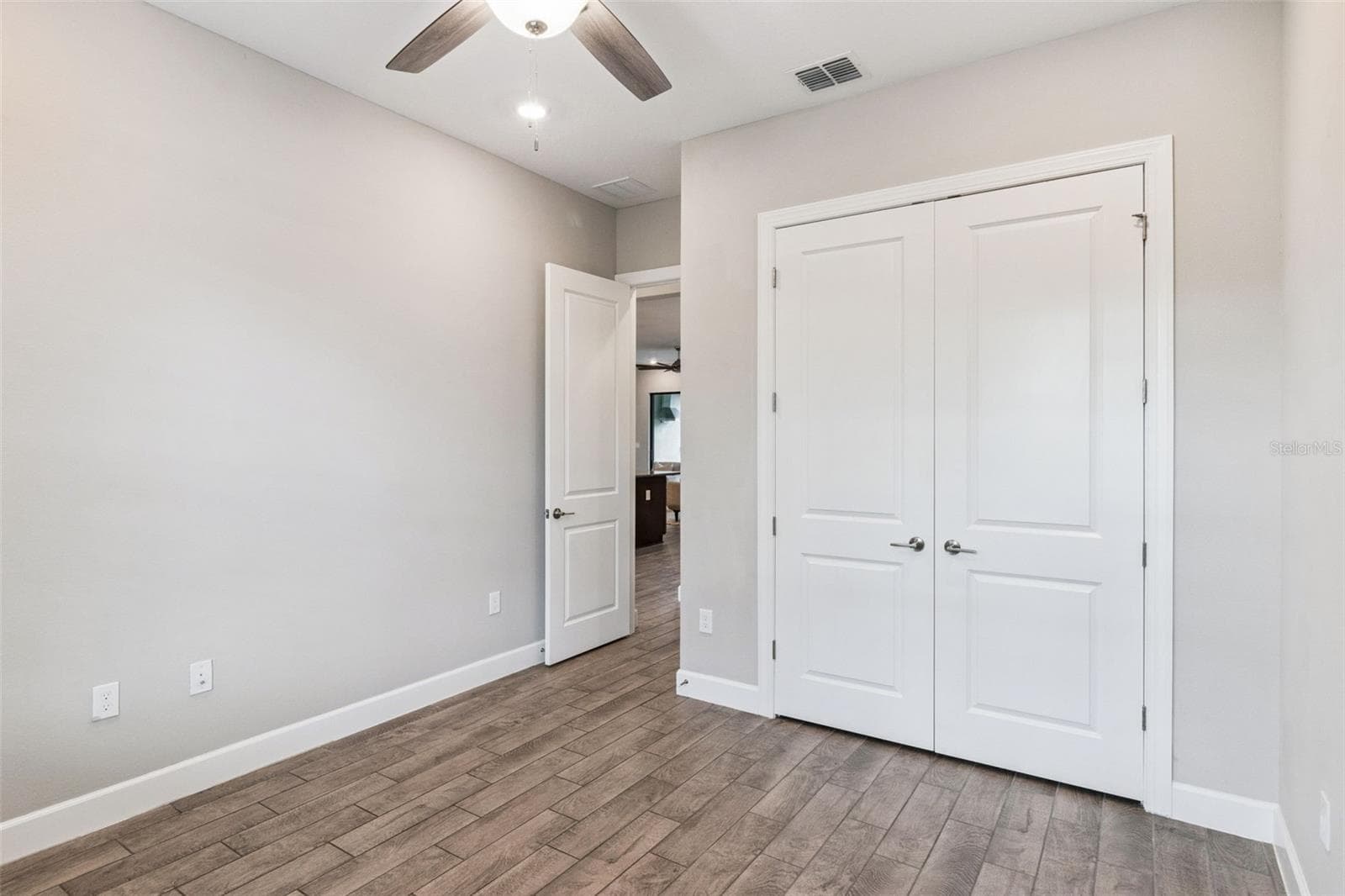 Third bedroom with double door closet and tile flooring. - 4108 VIA TOLEDO CT, POINCIANA